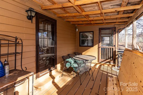 a view of a yard with wooden fence