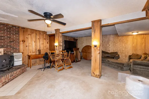 a view of a livingroom with furniture and a flat screen tv