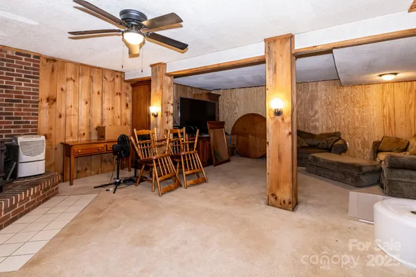 a living room with furniture and a porch
