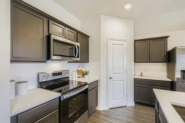 a dining room with furniture and wooden floor