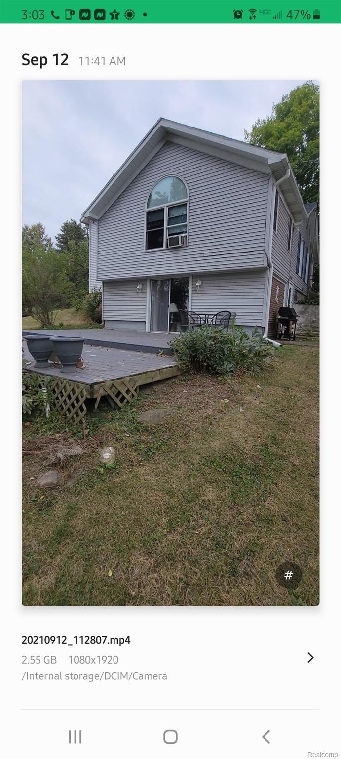 12749 Angle Road Bath, MI 48808 - Photo 5 of 33 Deck and Back of house.jpg