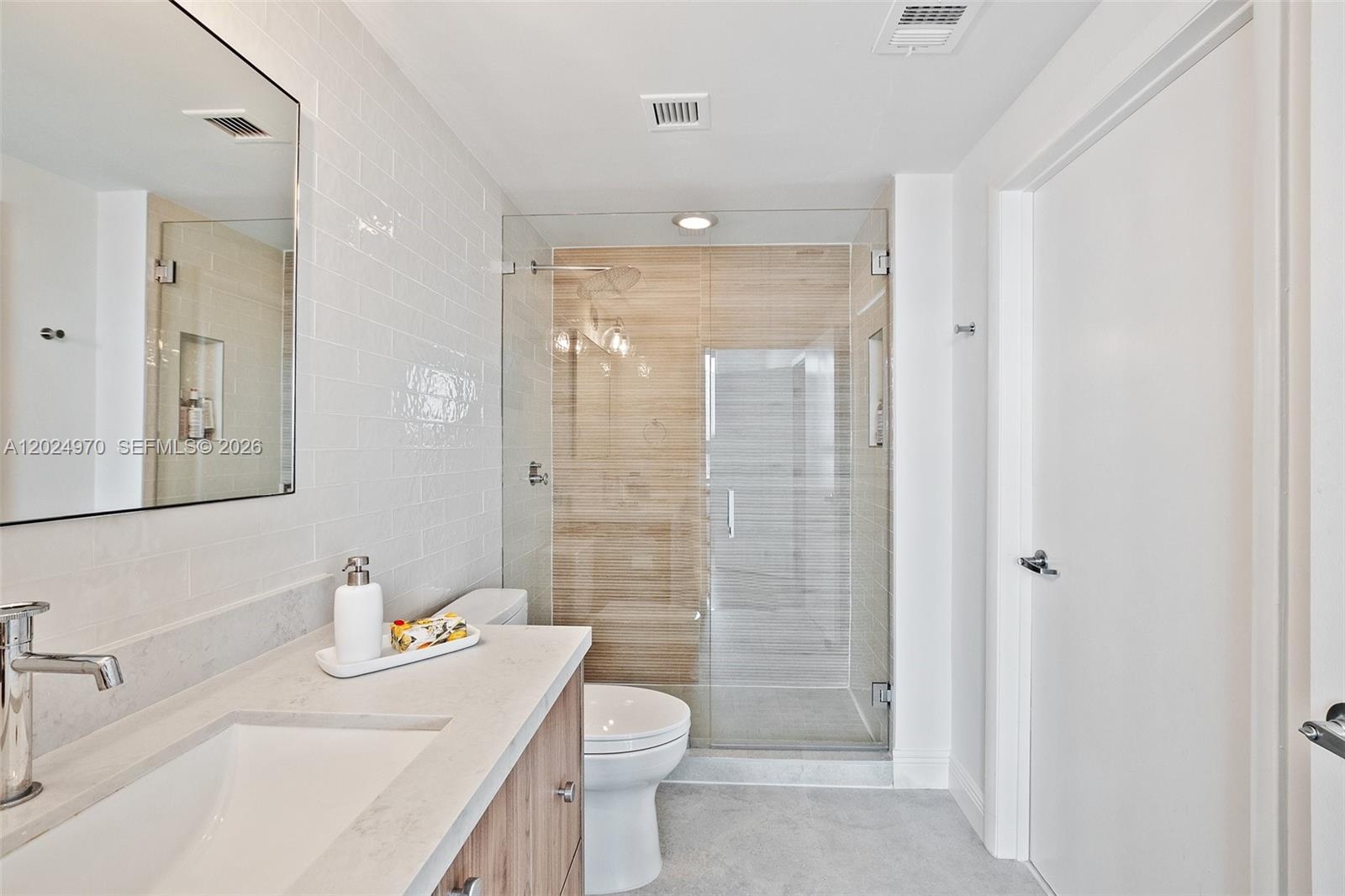 90 Southwest 3rd Street, Unit 3810 Miami, FL 33130 - Photo 26 of 45 a bathroom with a sink a toilet and shower