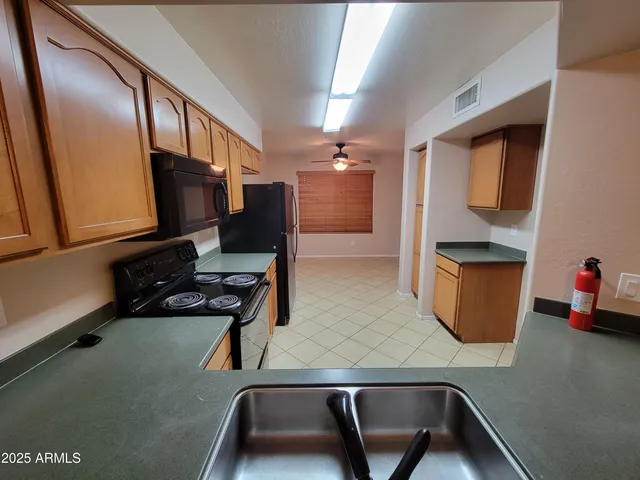 a room with wooden floor and furniture