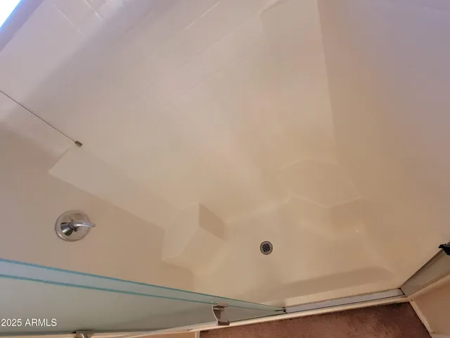 a view of a room with closet and windows