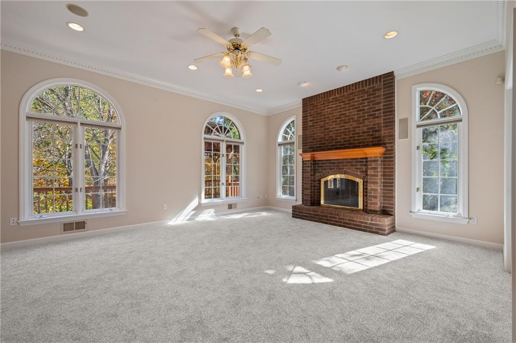 131 Hidden Valley Road Murrysville, PA 15668 - Photo 11 of 50 a view of an empty room with a fireplace and a window