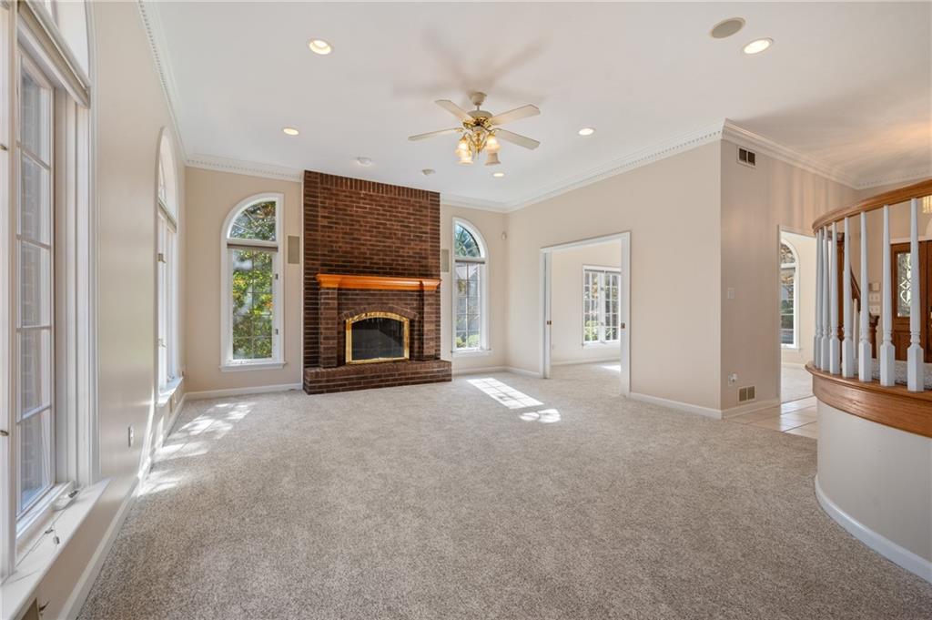 131 Hidden Valley Road Murrysville, PA 15668 - Photo 13 of 50 a view of empty room with fireplace and fan