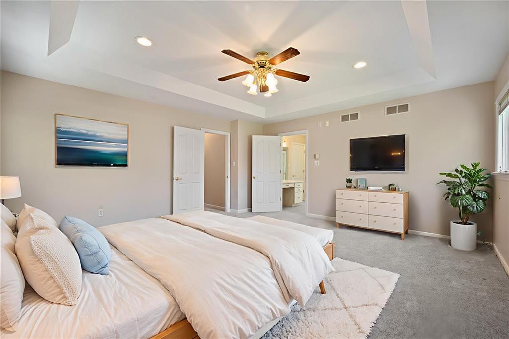 131 Hidden Valley Road Murrysville, PA 15668 - Photo 20 of 50 a bedroom with a large bed and a flat screen tv