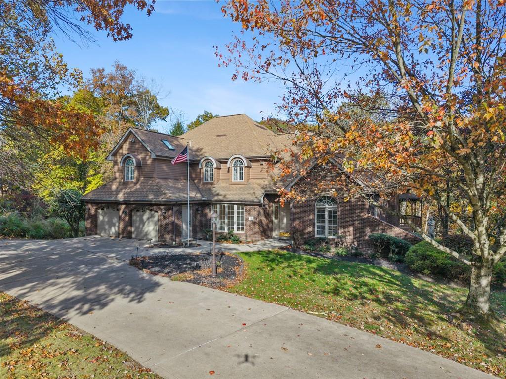 131 Hidden Valley Road Murrysville, PA 15668 - Photo 2 of 50 a front view of a house with a garden