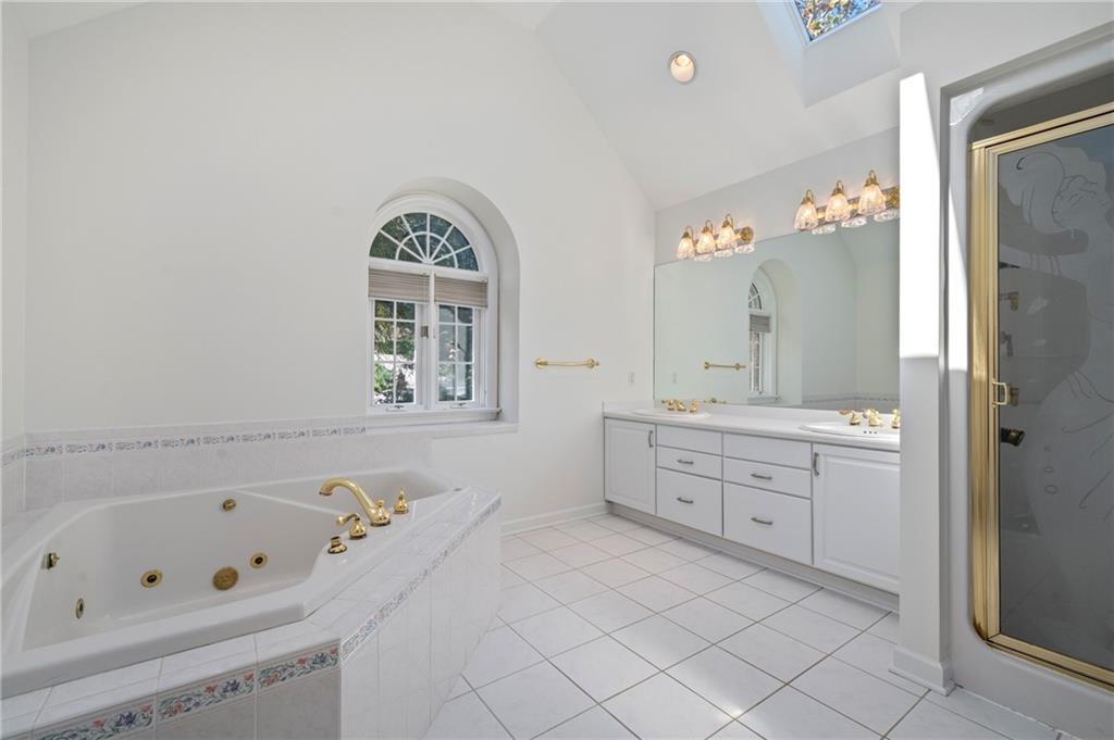131 Hidden Valley Road Murrysville, PA 15668 - Photo 25 of 50 a spacious bathroom with a granite countertop tub sink and mirror