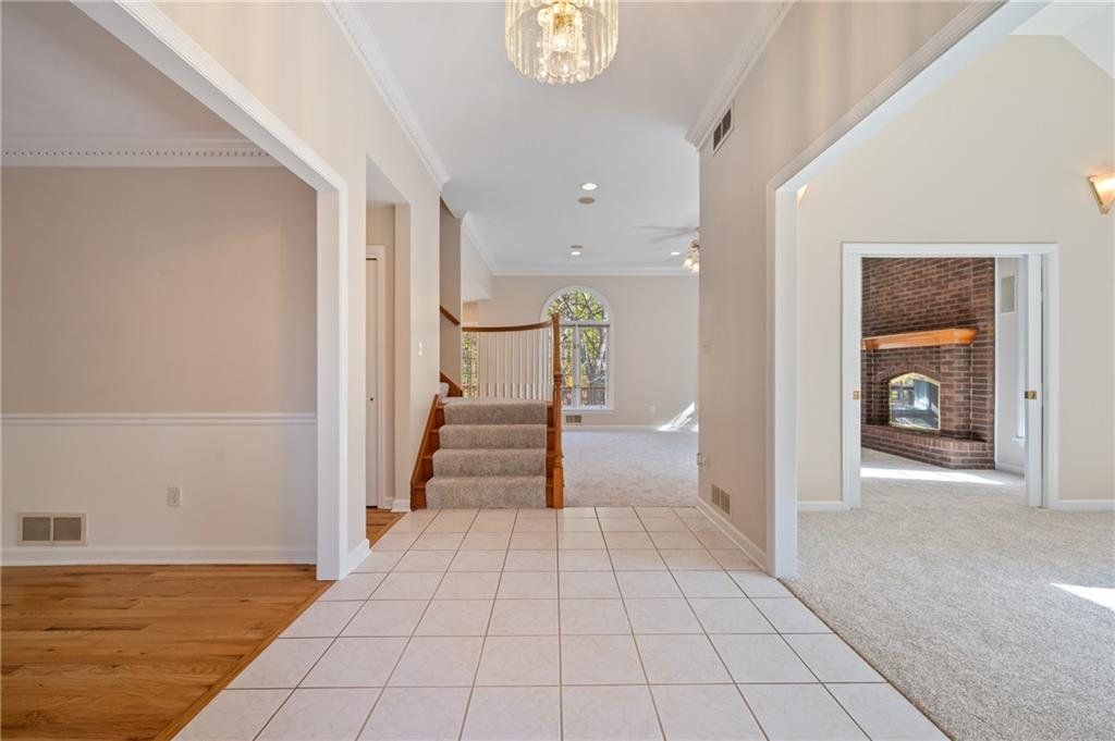 131 Hidden Valley Road Murrysville, PA 15668 - Photo 3 of 50 a view of a hallway with wooden floor and staircase