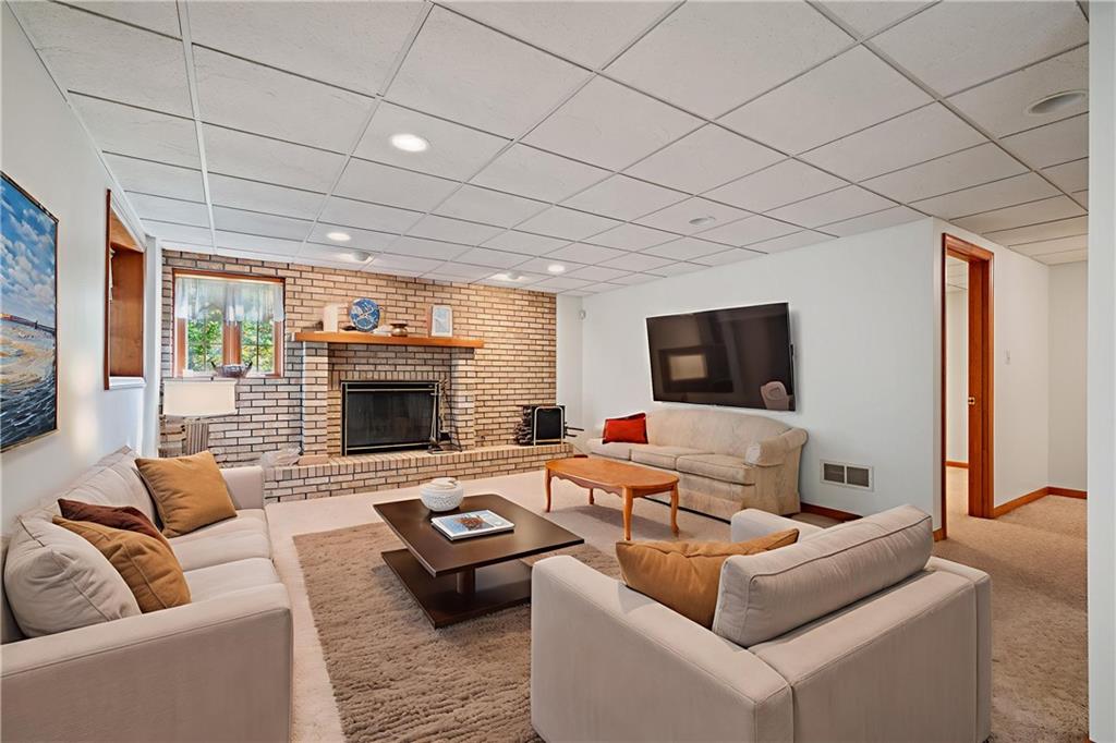 131 Hidden Valley Road Murrysville, PA 15668 - Photo 33 of 50 a living room with furniture and a fireplace