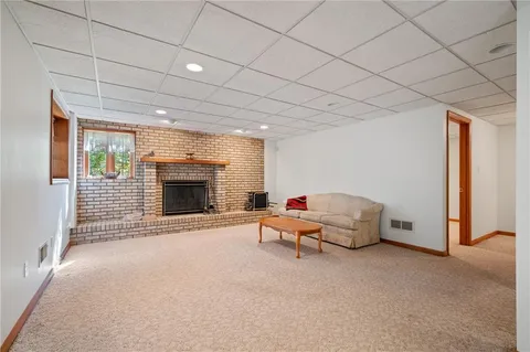 a spacious bedroom with a bed and a flat screen tv