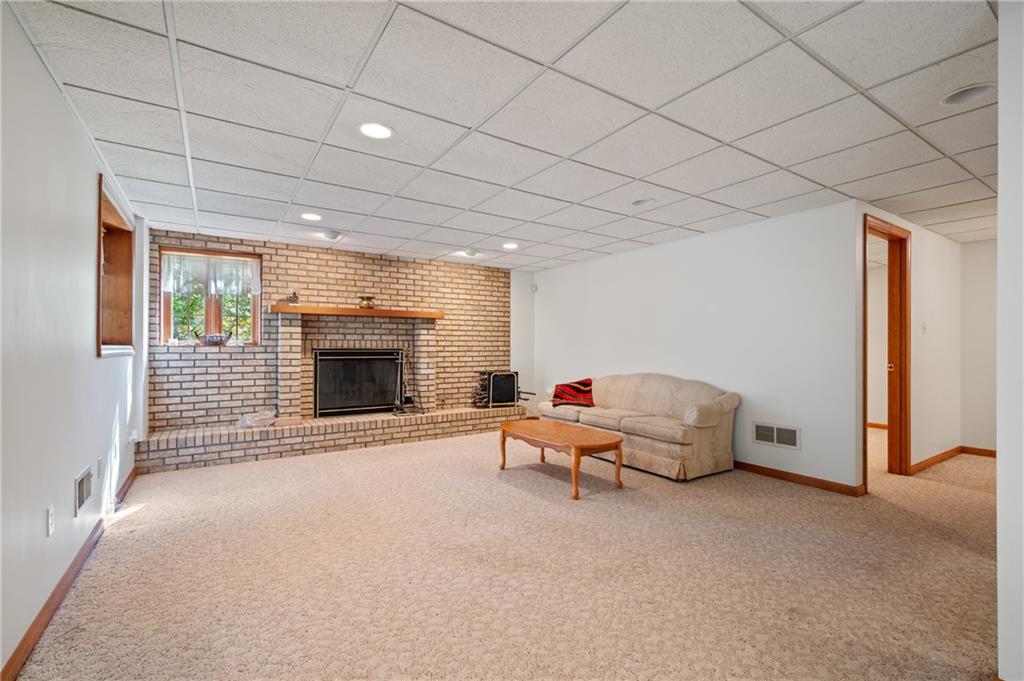131 Hidden Valley Road Murrysville, PA 15668 - Photo 34 of 50 a living room with furniture and a fireplace