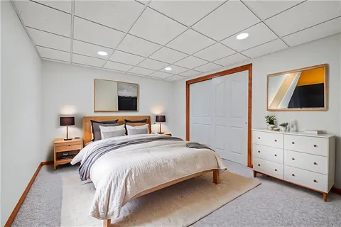 a open kitchen with granite countertop a stove top oven a sink dishwasher and a refrigerator with wooden floor