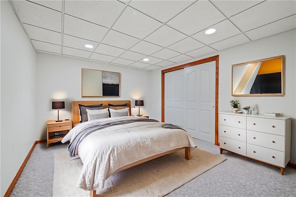 131 Hidden Valley Road Murrysville, PA 15668 - Photo 35 of 50 a spacious bedroom with a bed and a flat screen tv