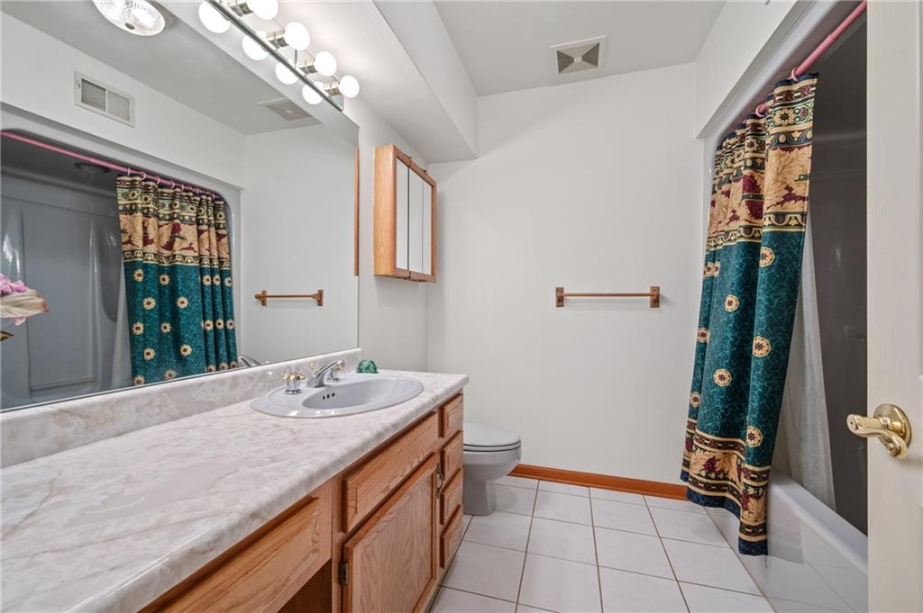 131 Hidden Valley Road Murrysville, PA 15668 - Photo 38 of 50 a bathroom with a sink a vanity and a mirror