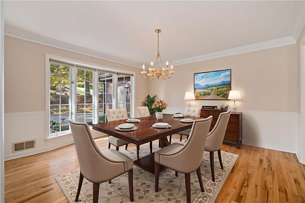 131 Hidden Valley Road Murrysville, PA 15668 - Photo 4 of 50 a dining room with furniture a chandelier and wooden floor