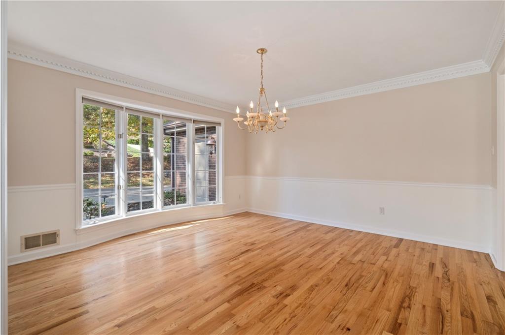 131 Hidden Valley Road Murrysville, PA 15668 - Photo 5 of 50 a view of an empty room with wooden floor and a window
