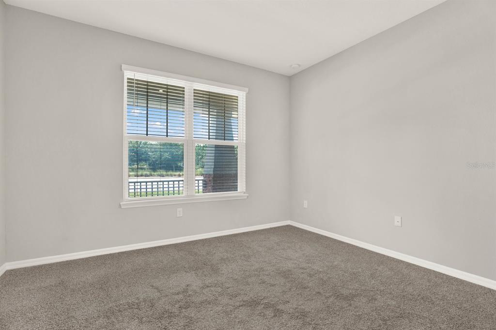 13729 Rangeland Boulevard Odessa, FL 33556 - Photo 10 of 30 an empty room with a window