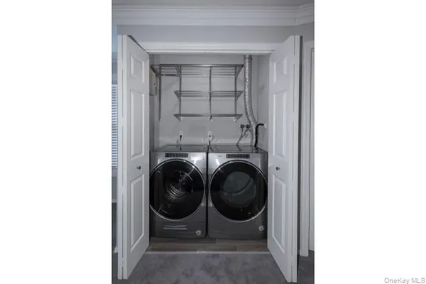 a utility room with dryer and washer