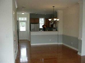 120 South Square Row Davidson, NC 28036 - Photo 4 of 8 a view of a room with a mirror and hardwood floor