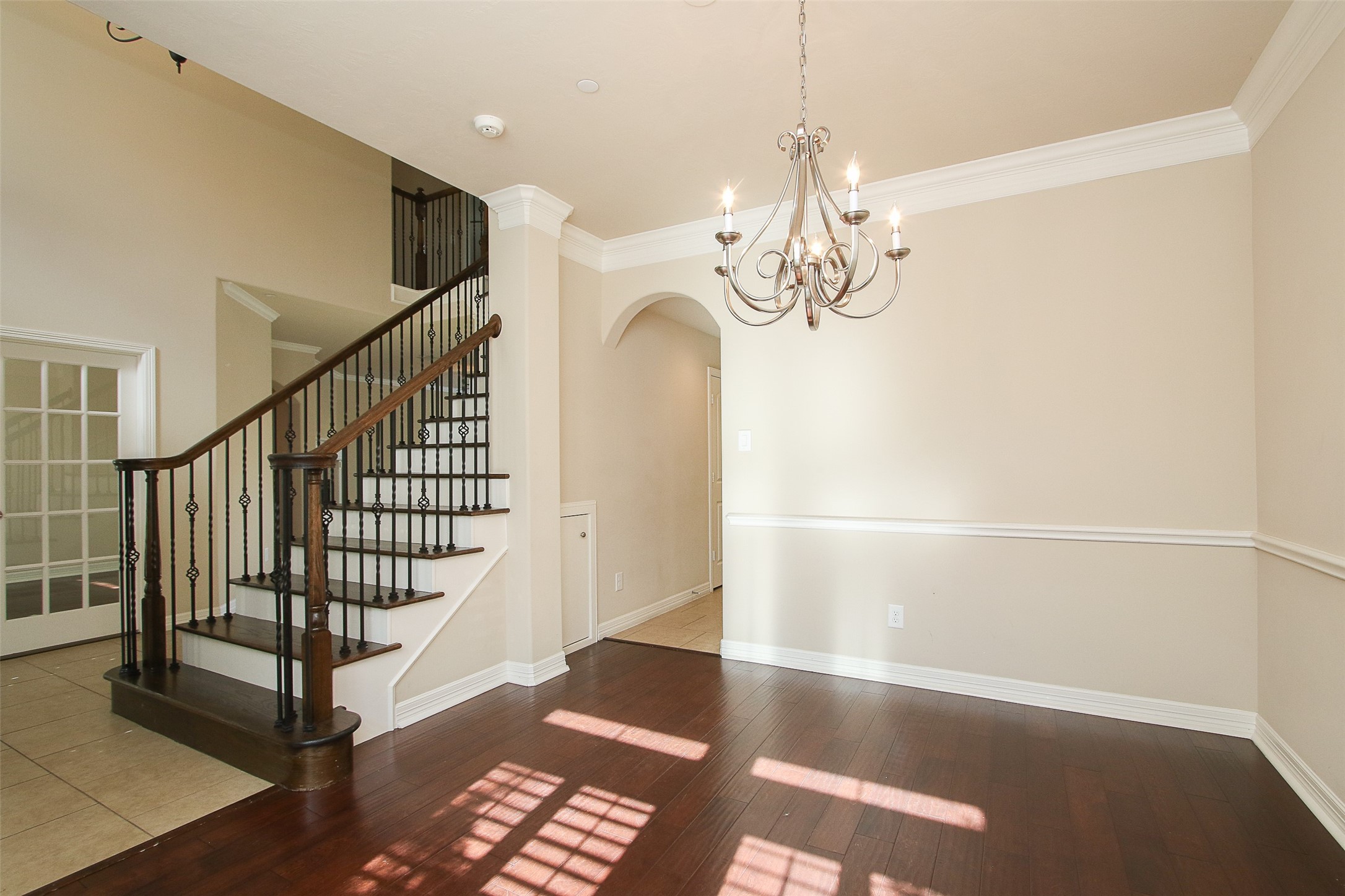 11722 Spriggs Way Houston, TX 77024 - Photo 10 of 49 Formal dining room with arched entry leading to the kitchen