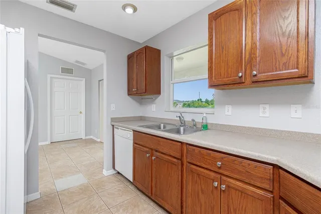 a kitchen with a sink and cabinets