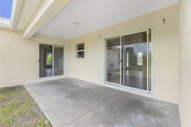 a kitchen with a sink cabinets and a window