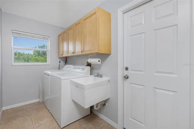a view of a house with yard and sitting area