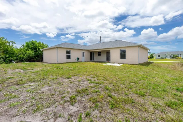 a backyard of a house with lots of green space