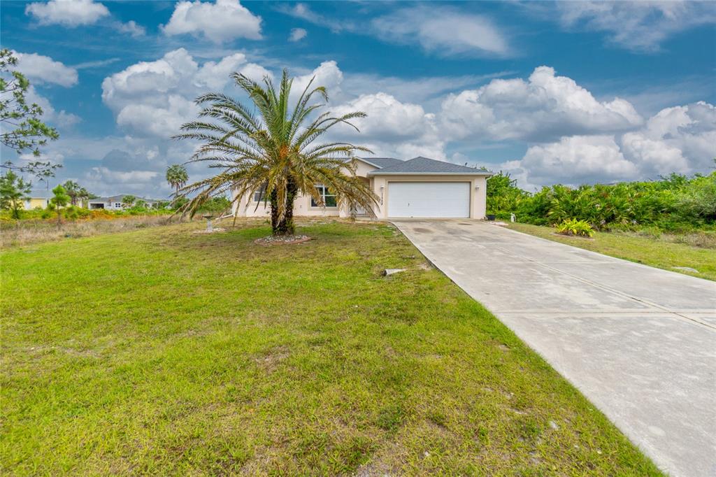 11708 Willmington Boulevard Port Charlotte, FL 33981 - Photo 38 of 41 a view of a yard in front of the house