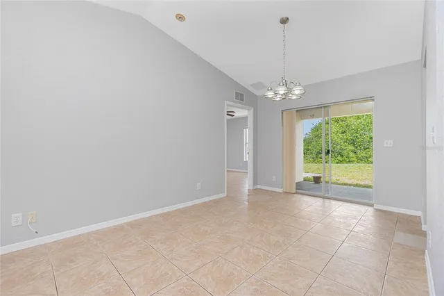 a view of a room with window chandelier and carpet