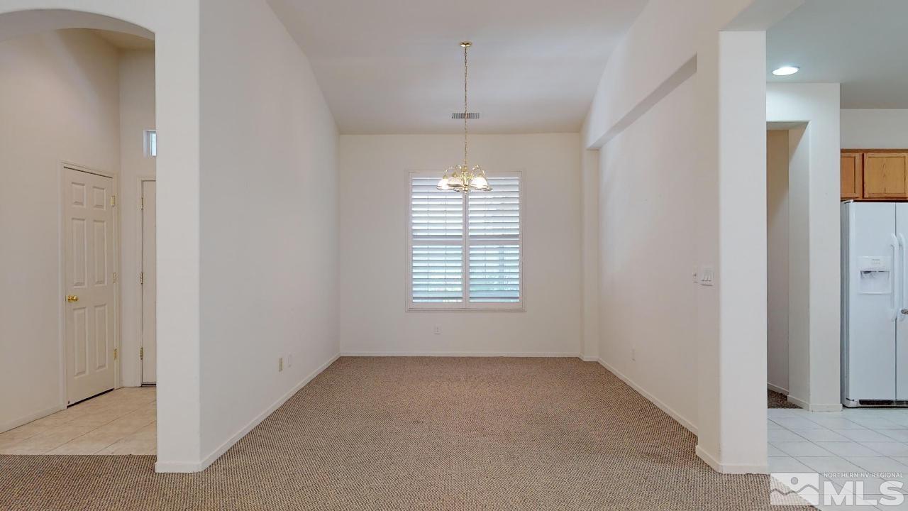 1437 Wild Wolf Way Reno, NV 89521 - Photo 8 of 20 a view of an empty room with a window