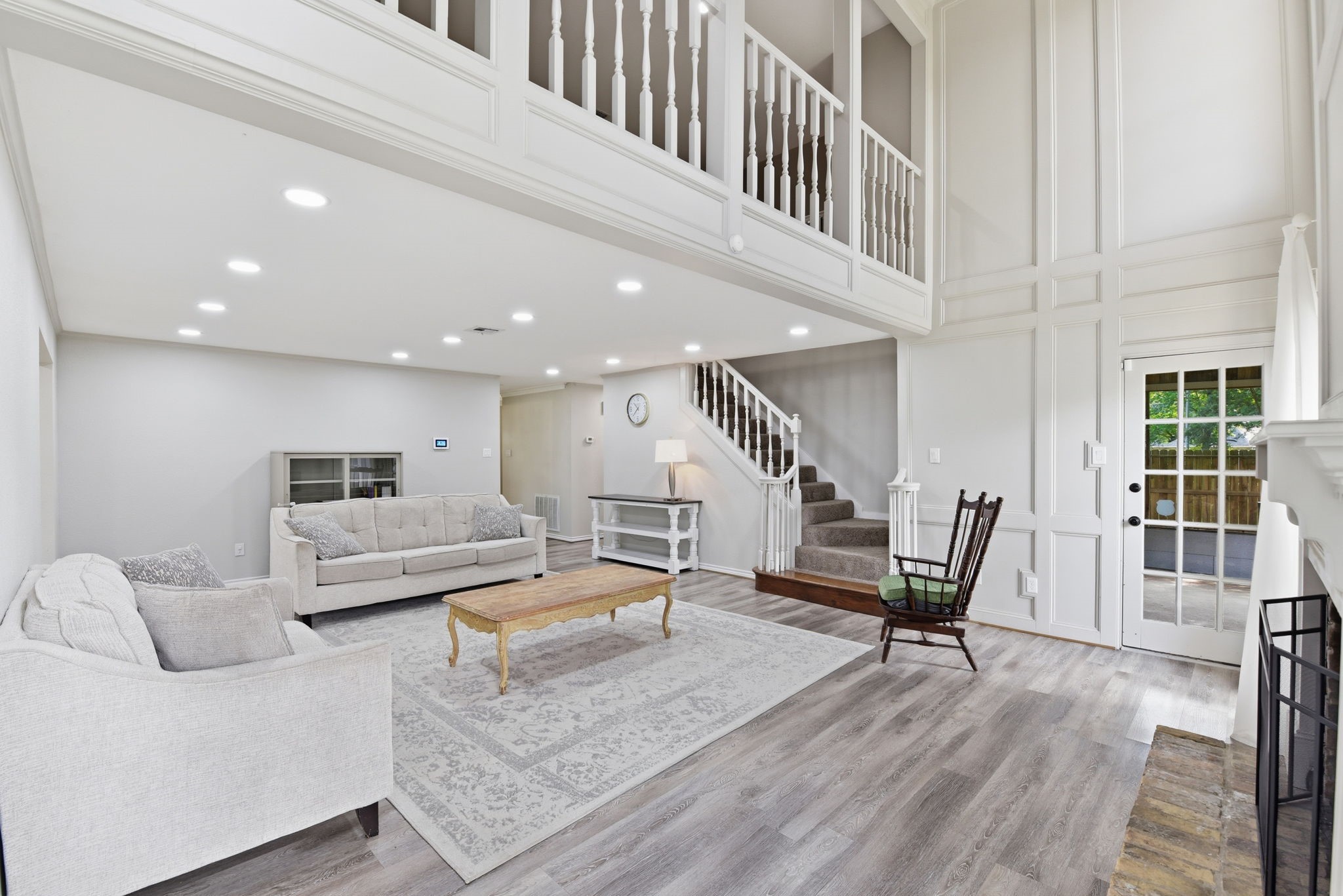 3603 Beech Hill Drive Spring, TX 77388 - Photo 11 of 44 Dramatic two-story ceilings and abundant natural light create an open, airy feel anchored by a beautiful fireplace—designed for both comfort and connection.