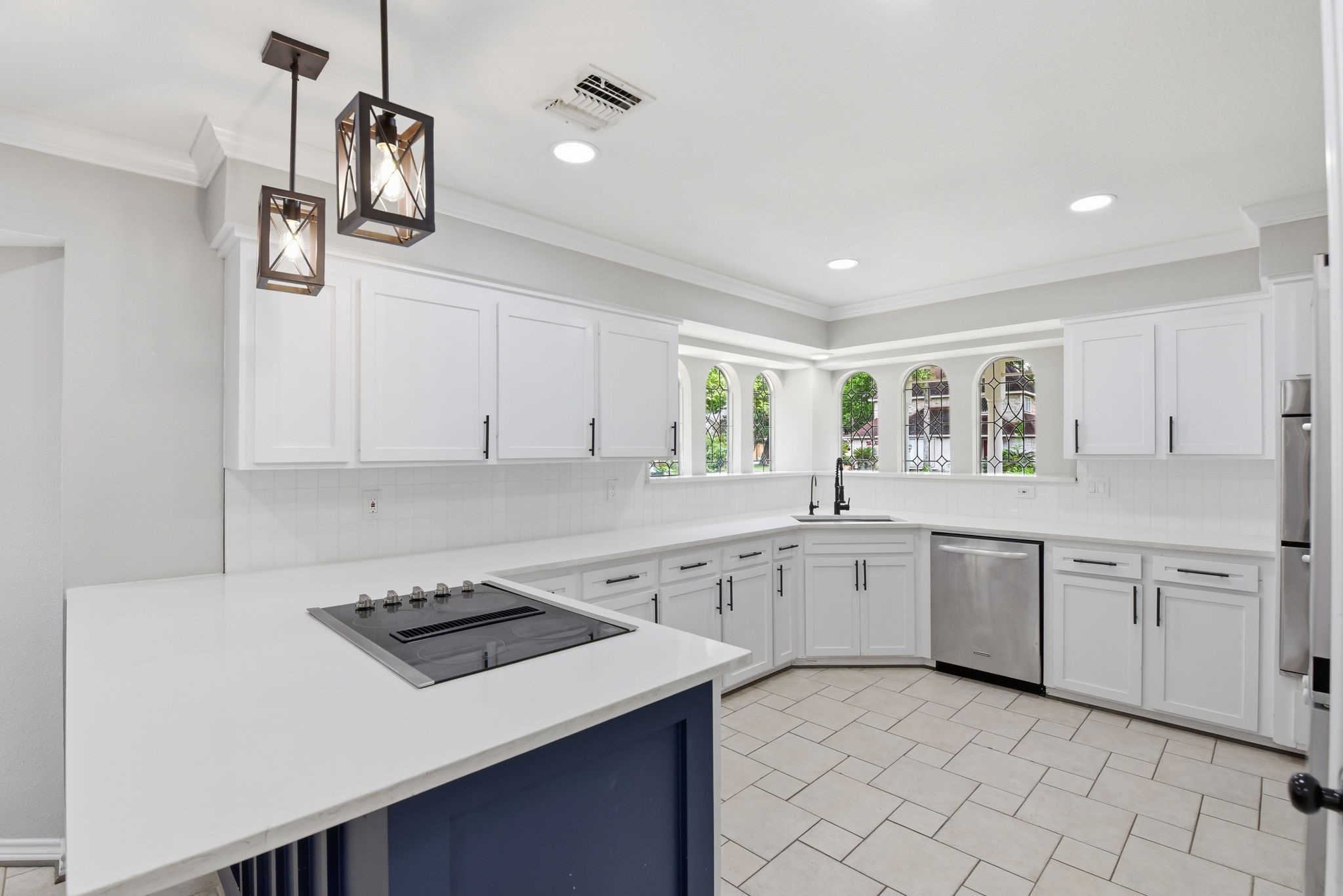 3603 Beech Hill Drive Spring, TX 77388 - Photo 18 of 44 Beautiful stainless appliances, pendant lighting over the peninsula and quartz counters make this a great space to cook in. There are double ovens as well, so you can get everything done at one time!