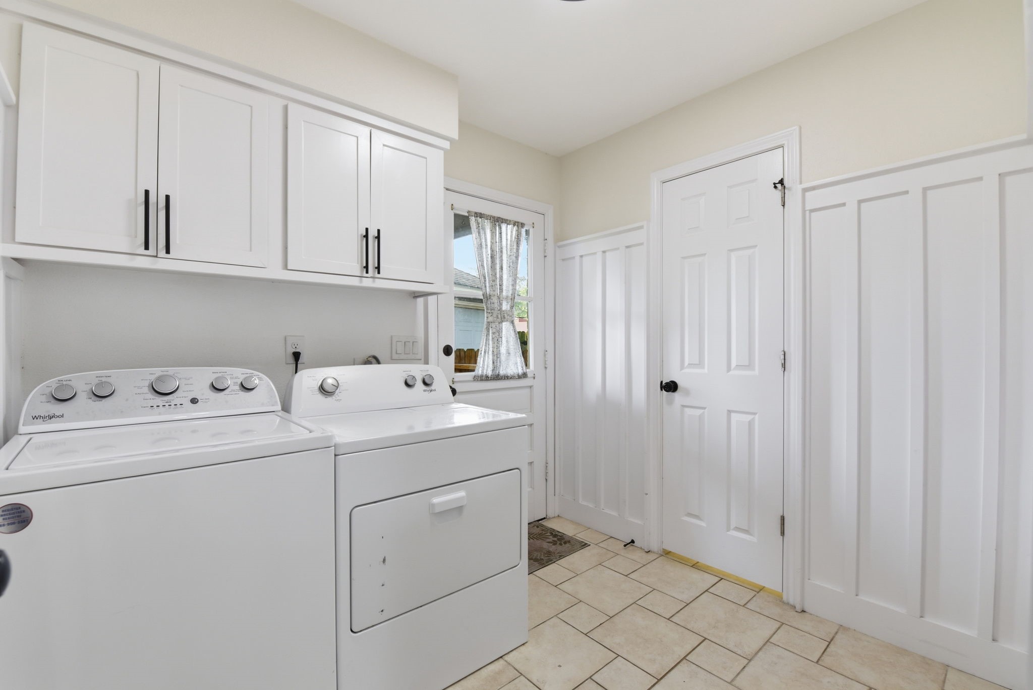 3603 Beech Hill Drive Spring, TX 77388 - Photo 28 of 44 The Laundry Room is spacious and has additional storage. The board and batten finish on the wall adds extra charm.
