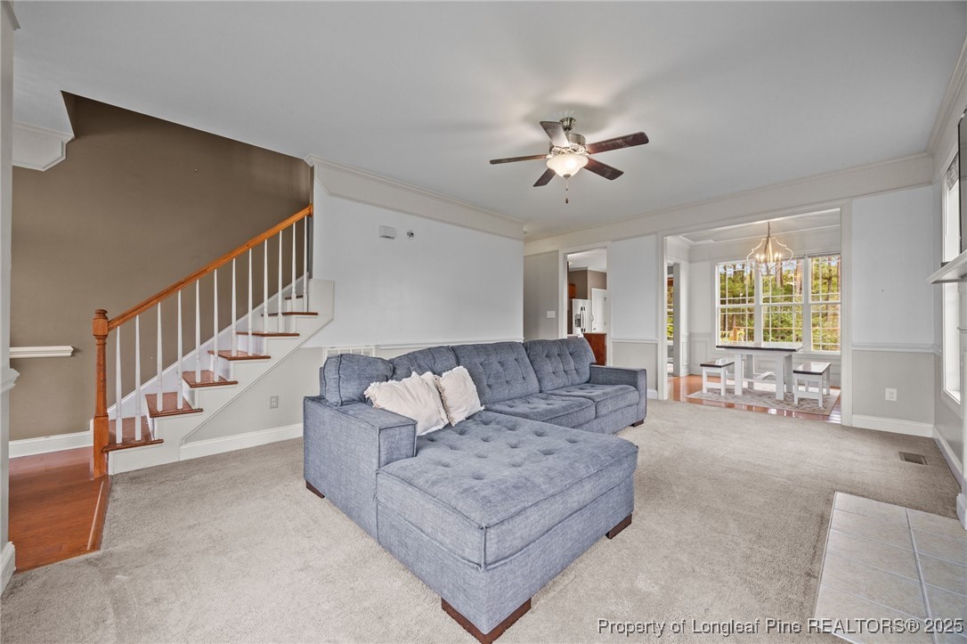 10 Braxton Court Erwin, NC 28339 - Photo 12 of 28 a living room with furniture and a chandelier