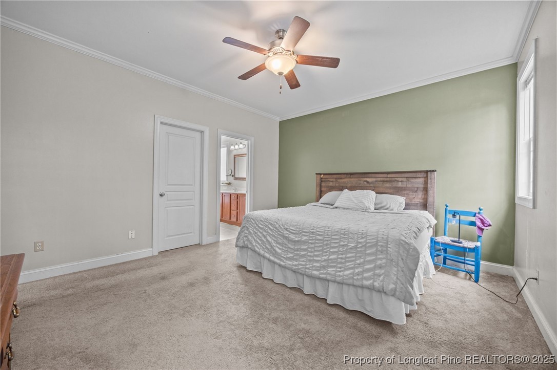 10 Braxton Court Erwin, NC 28339 - Photo 17 of 28 a bedroom with a bed and a ceiling fan