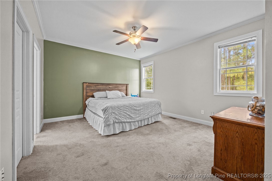 10 Braxton Court Erwin, NC 28339 - Photo 18 of 28 a bedroom with a bed and a table in it