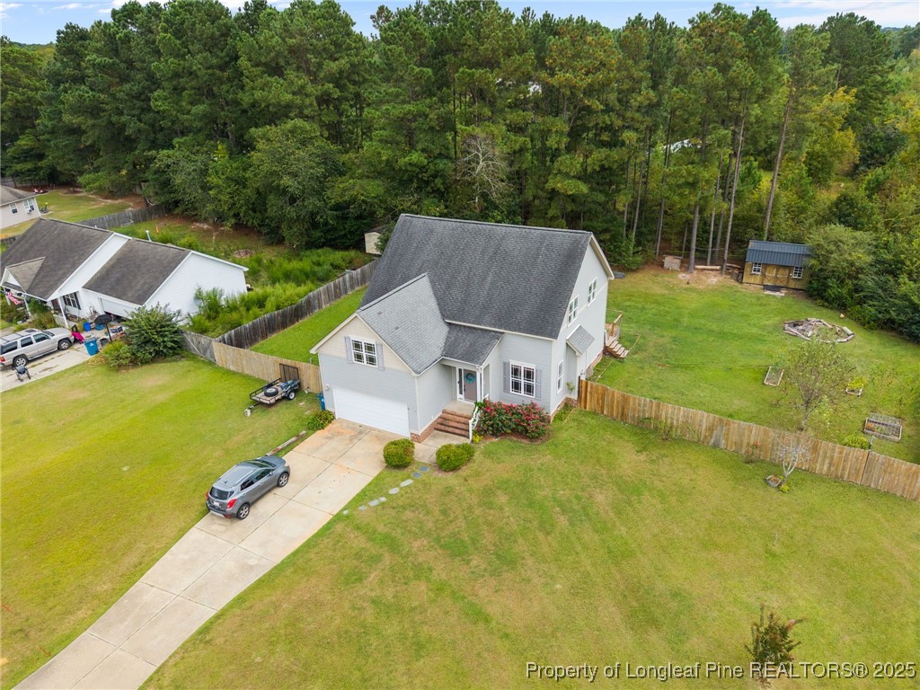 10 Braxton Court Erwin, NC 28339 - Photo 2 of 28 a view of a house with pool and a yard
