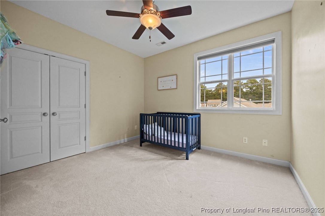 10 Braxton Court Erwin, NC 28339 - Photo 21 of 28 a view of livingroom with hardwood floor and a ceiling fan