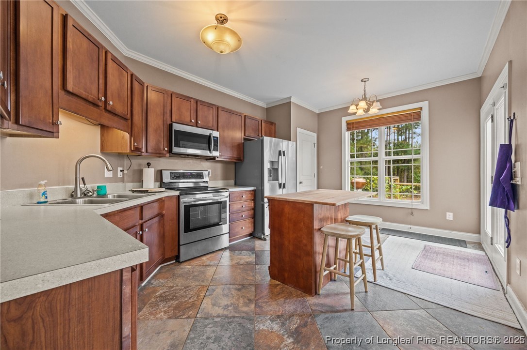 10 Braxton Court Erwin, NC 28339 - Photo 8 of 28 a kitchen with granite countertop a stove cabinets and microwave