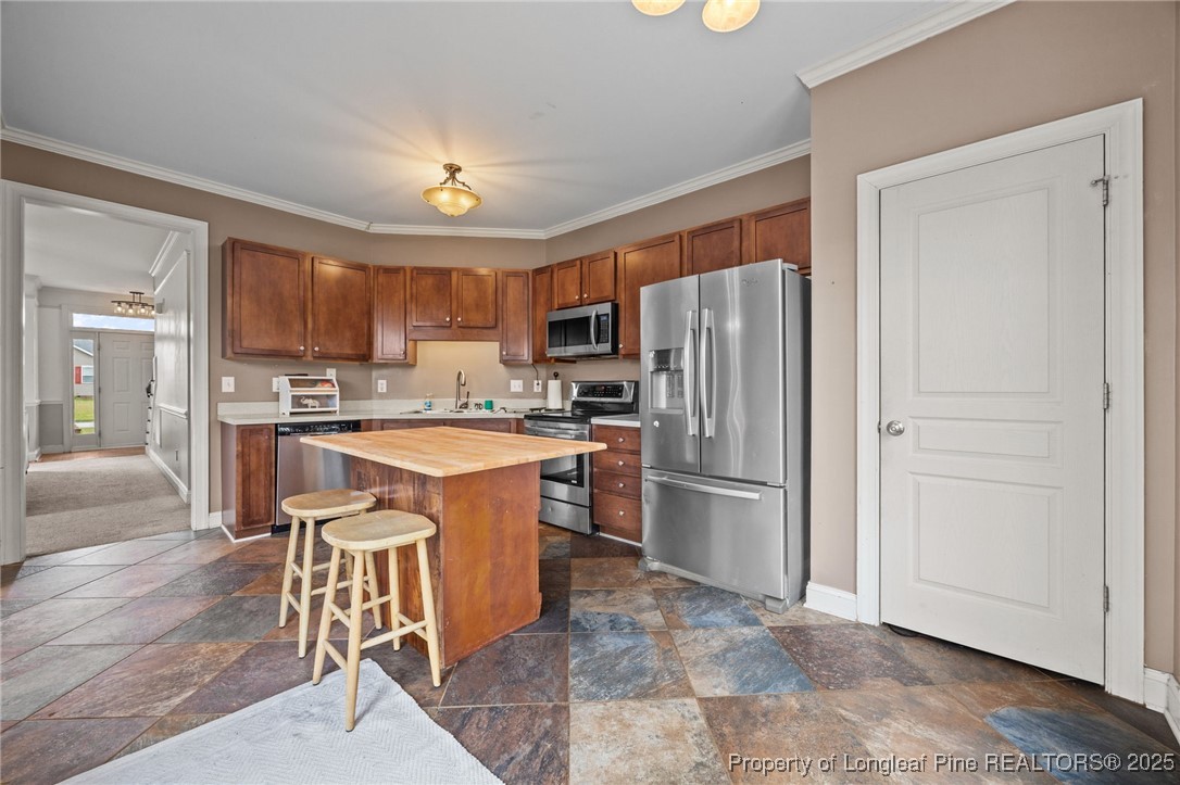 10 Braxton Court Erwin, NC 28339 - Photo 10 of 28 a kitchen with stainless steel appliances granite countertop a refrigerator stove top oven and sink