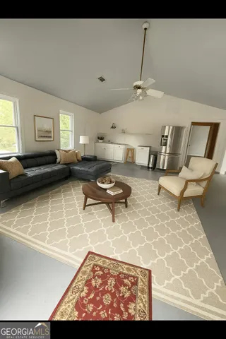 a living room with furniture and a window