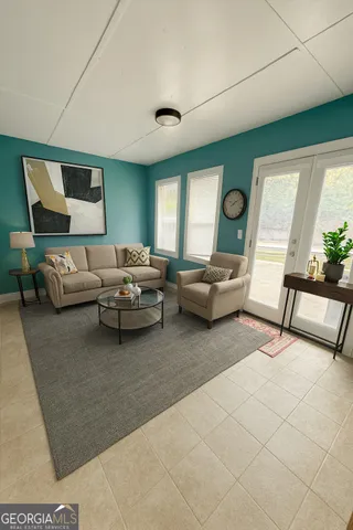 a living room with furniture and a window