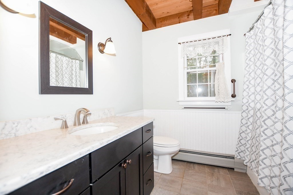 58 Alley Road Rochester, MA 02770 - Photo 28 of 29 a bathroom with a sink a toilet and a window