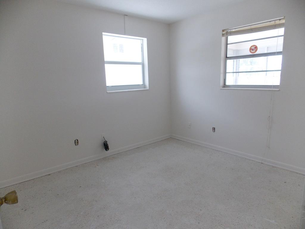 100 Southwest Hideaway Place Stuart, FL 34994 - Photo 13 of 23 an empty room with a window