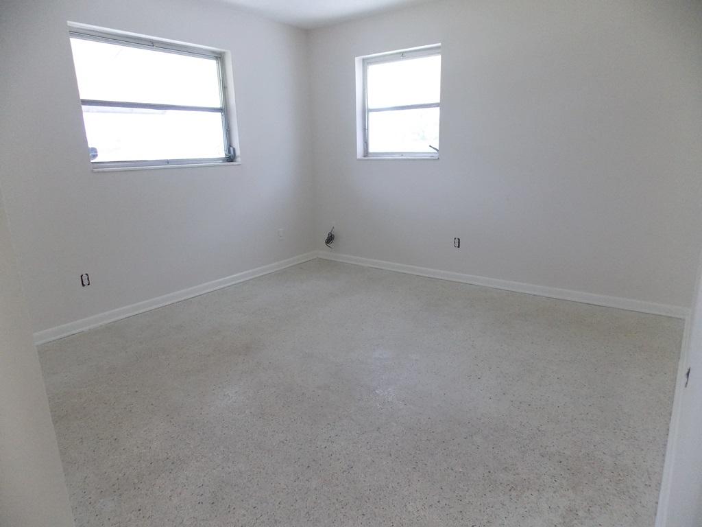 100 Southwest Hideaway Place Stuart, FL 34994 - Photo 14 of 23 an empty room with a window