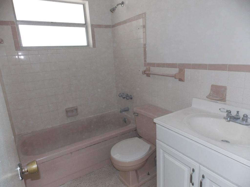 100 Southwest Hideaway Place Stuart, FL 34994 - Photo 15 of 23 a bathroom with a sink toilet and shower