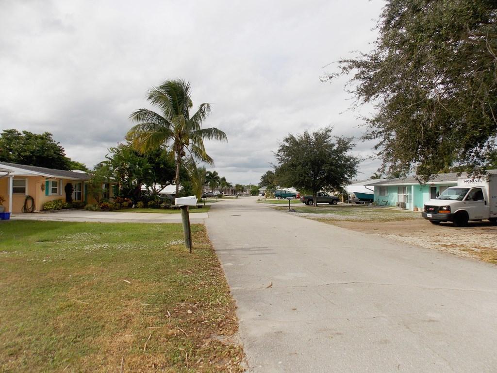 100 Southwest Hideaway Place Stuart, FL 34994 - Photo 23 of 23 a view of street with parked cars